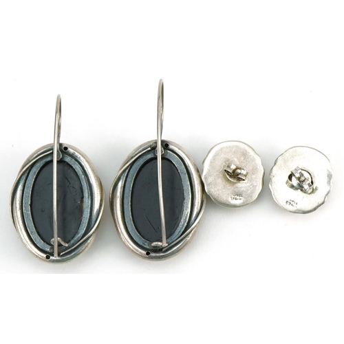 2678 - Two pairs of silver earrings including a pair of natural amber style cabochons, the largest 4.0cm hi... 