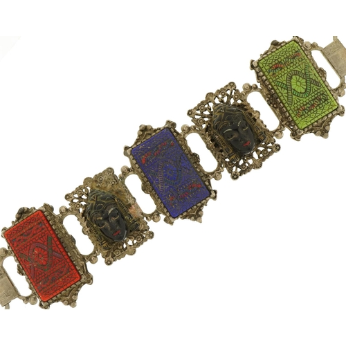 2657 - Thai white metal panelled bracelet with carved busts, 18cm in length, 77.0g