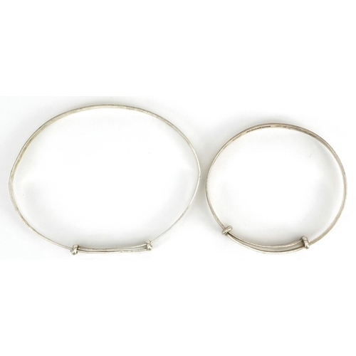 2605 - Two silver christening bangles with engraved decoration, one hallmarked 1973, total 9.1g