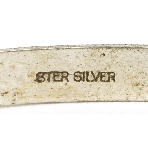 2605 - Two silver christening bangles with engraved decoration, one hallmarked 1973, total 9.1g