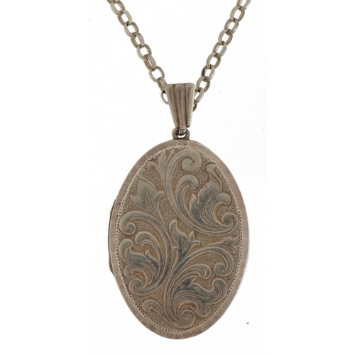 2590 - Silver oval locket with floral decoration on a silver Belcher link necklace, 4.0cm high and 45cm in ... 