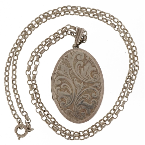 2590 - Silver oval locket with floral decoration on a silver Belcher link necklace, 4.0cm high and 45cm in ... 