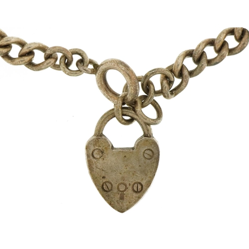 2586 - Silver curb link bracelet with love heart padlock, 18.5cm in length, 10.7g