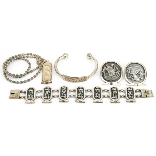 2661 - Egyptian Revival silver jewellery comprising two bust brooches, hieroglyphic pendant on chain, cuff ... 