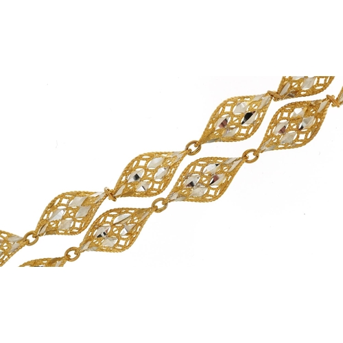 2217 - 9ct two tone gold pierced twisted design necklace, 46cm in length, 12.9g