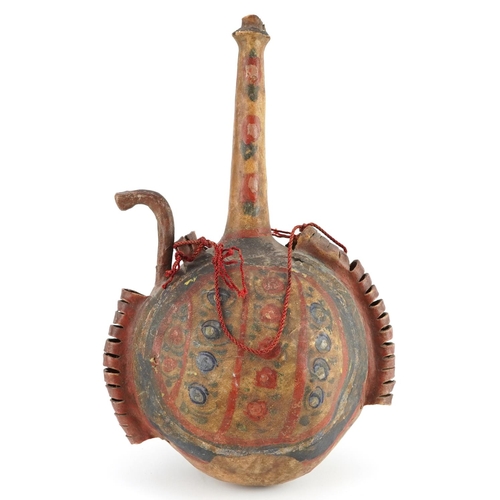 150 - Islamic vellum flask hand painted with stylised floral motifs, 35cm high