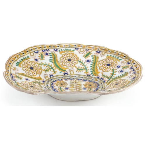 144 - Turkish Ottoman Kutahya barber's bowl hand painted with stylised flowers and foliage, 28cm wide