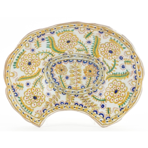 144 - Turkish Ottoman Kutahya barber's bowl hand painted with stylised flowers and foliage, 28cm wide