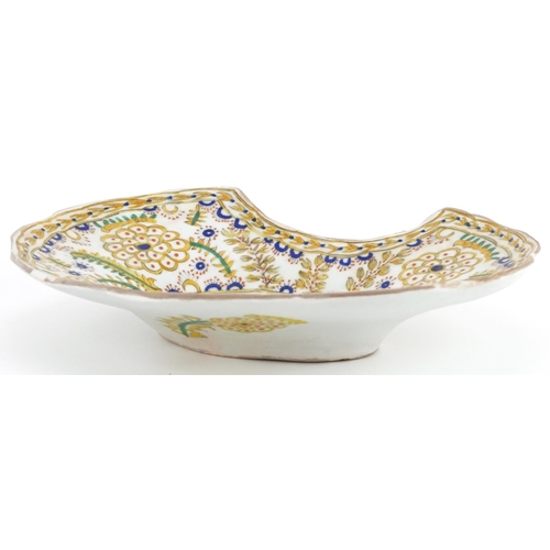 144 - Turkish Ottoman Kutahya barber's bowl hand painted with stylised flowers and foliage, 28cm wide