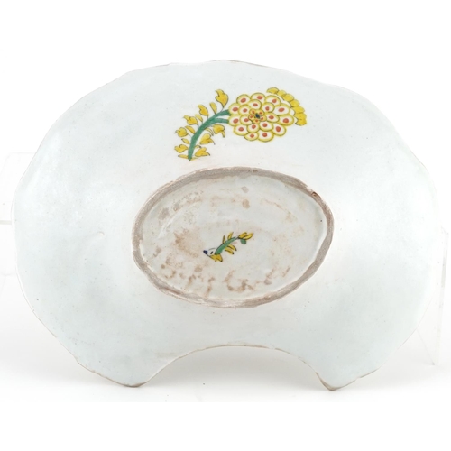 144 - Turkish Ottoman Kutahya barber's bowl hand painted with stylised flowers and foliage, 28cm wide