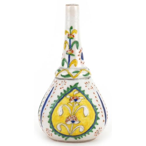 147 - Turkish Ottoman Kutahya rosewater sprinkler hand painted with stylised flowers, 14cm high