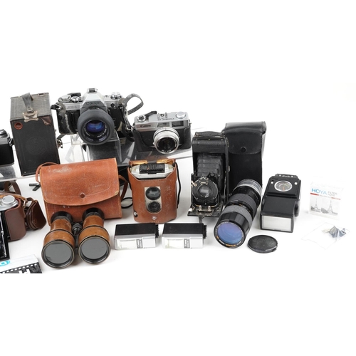 1253 - Vintage and later cameras and accessories including Minolta X-300, Canon AE-1 and Kodak Brownie no 2... 