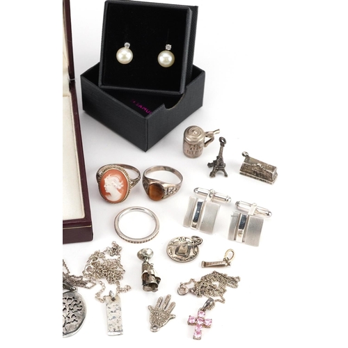 2760 - Silver and white metal jewellery including charms, pendants on chains, Camelot love heart necklace w... 