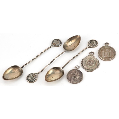 1360 - Silver motorcycling interest objects comprising three sports jewels and three teaspoons, the spoons ... 