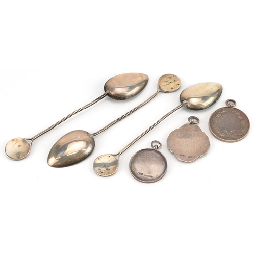 1360 - Silver motorcycling interest objects comprising three sports jewels and three teaspoons, the spoons ... 