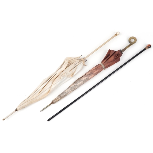 518 - Two Edwardian parasols and an ebonised walking stick with iridescent stone pommel and gilt metal mou... 