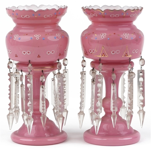  Pair of Victorian pink opaline glass lustres with drops, each enamelled with flowers, each 31.5cm hi... 