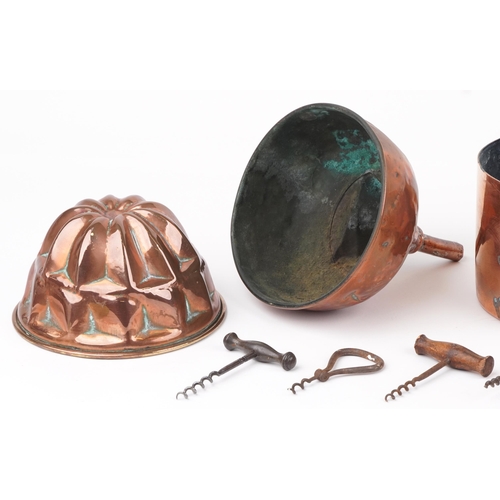 581 - 18th/19th century and later kitchenalia including four copper funnels, jelly mould, saucepan and cor... 