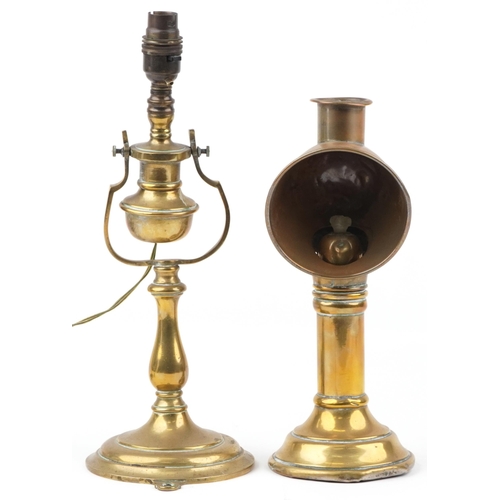 579 - Two antique brass lamps comprising a candle lamp by Veritas Lamp Works and a shipping interest gimba... 