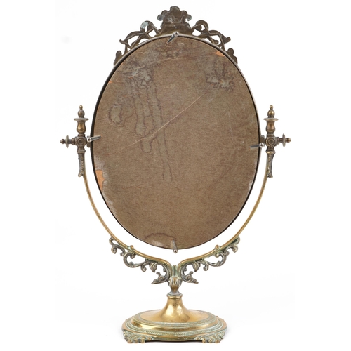 1308 - Vintage classical brass swing mirror with urn finials, 52cm high