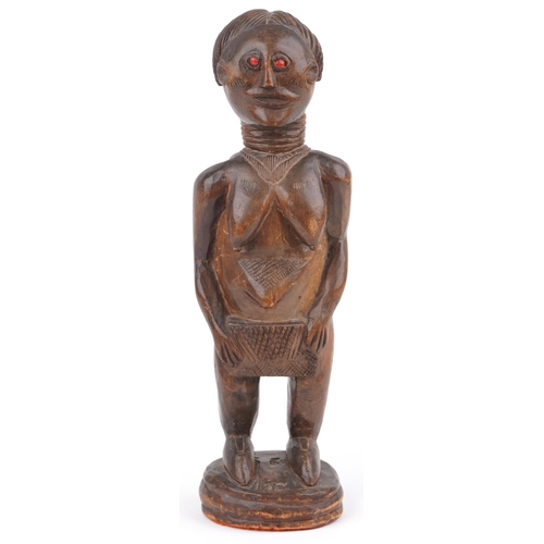 67 - African carved hardwood fertility figure of a nude female, 39.5cm high