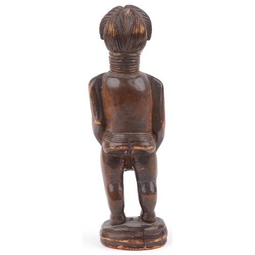 67 - African carved hardwood fertility figure of a nude female, 39.5cm high