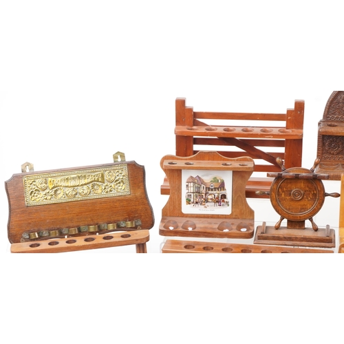 1494 - Collection of smoking interest wooden pipe racks including an Indian example profusely carved with f... 