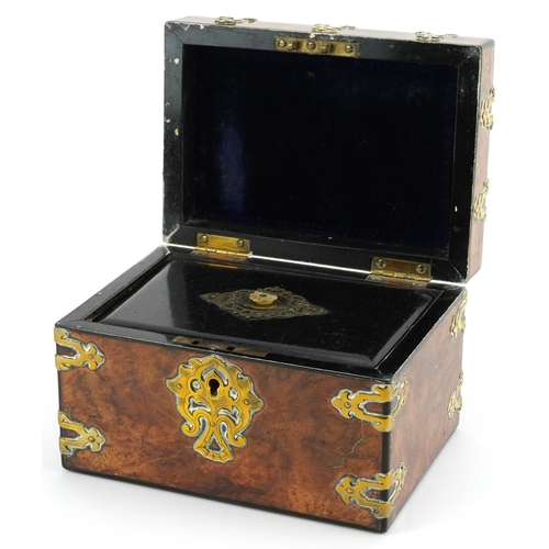 108 - Victorian Gothic style burr walnut tea caddy with brass mounts and interior ebonised lid having moth... 