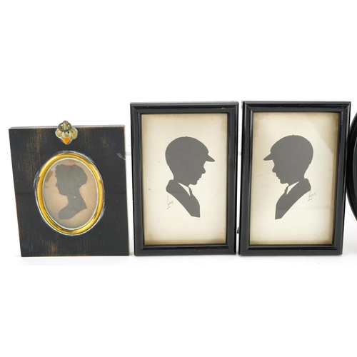 244 - Five Georgian and later hand painted and cut out silhouette portrait miniatures housed in ebonised f... 