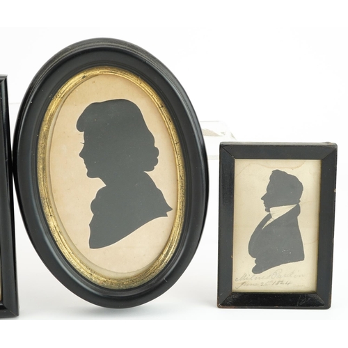 244 - Five Georgian and later hand painted and cut out silhouette portrait miniatures housed in ebonised f... 