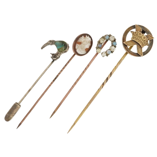 2576 - Four yellow and white metal stickpins including one unmarked gold and a cameo shell carved with a ma... 