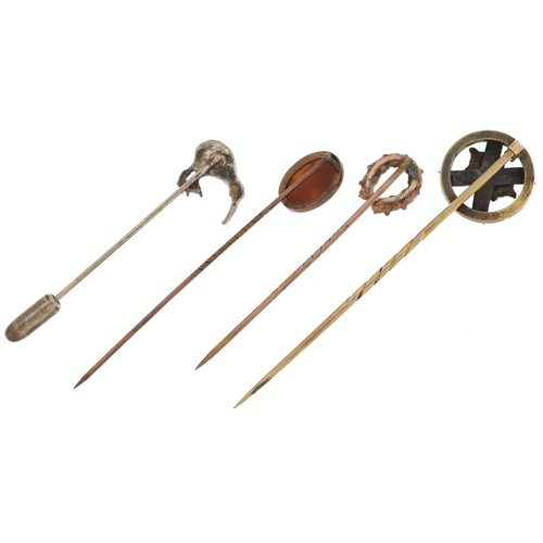 2576 - Four yellow and white metal stickpins including one unmarked gold and a cameo shell carved with a ma... 