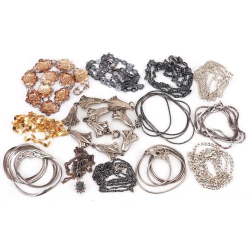 2676 - Silver jewellery comprising eleven necklaces and two floral bracelets, 55.0g