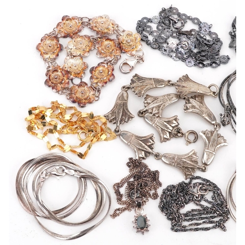 2676 - Silver jewellery comprising eleven necklaces and two floral bracelets, 55.0g