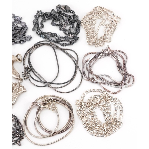 2676 - Silver jewellery comprising eleven necklaces and two floral bracelets, 55.0g