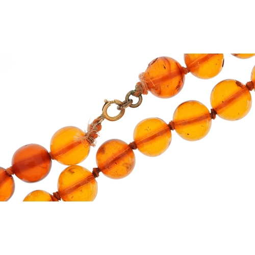 2658 - Natural amber coloured bead necklace, each bead approximately 12.5mm in diameter, overall 70cm in le... 