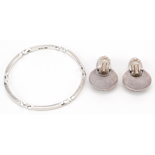 2645 - Heavy Modernist silver bangle and pair of Victorian style sterling silver clip on earrings, the bang... 