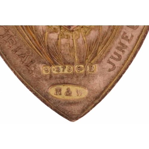 2159 - George V 9ct rose gold shield shaped sports jewel, Birmingham 1926, 3.2cm high, 4.9g