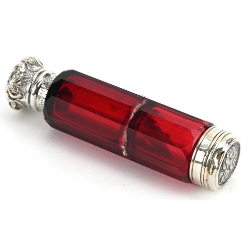 64 - Victorian ruby glass double ended scent bottle with unmarked silver mounts, 10cm in length