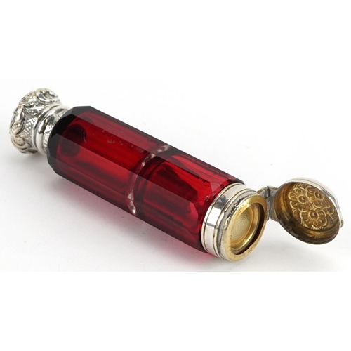 64 - Victorian ruby glass double ended scent bottle with unmarked silver mounts, 10cm in length