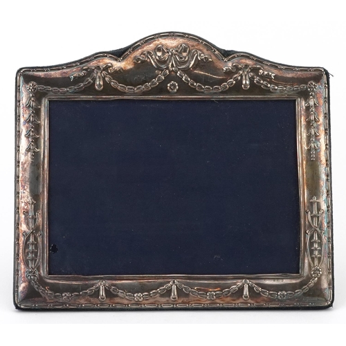 104 - Carrs, rectangular silver easel photo frame embossed with swags and bows, Sheffield 2006, 22cm x 19.... 