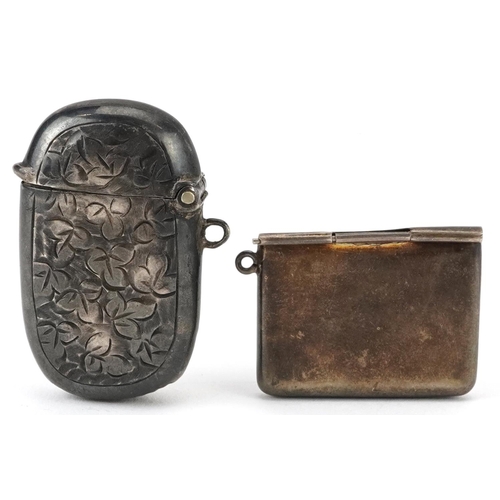 394 - Edwardian silver floral engraved vesta and a stamp case in the form of an envelope, the largest 4cm ... 