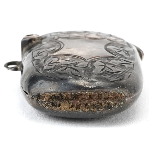 394 - Edwardian silver floral engraved vesta and a stamp case in the form of an envelope, the largest 4cm ... 