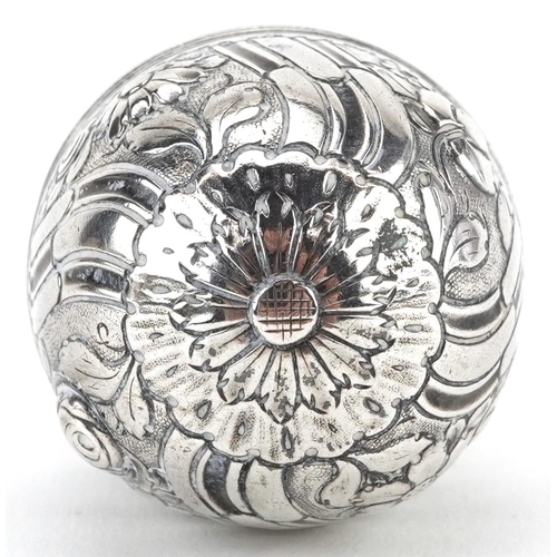 234 - Unmarked silver trinket box in the form of an egg embossed with flowers and foliage, 5cm high, 15.4g