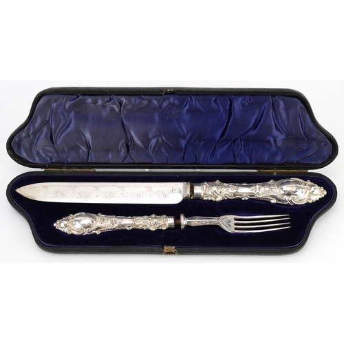 1319 - Victorian silver handled knife and fork with silver plated blades housed in a velvet and silk lined ... 