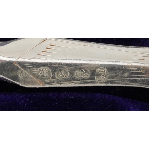 1319 - Victorian silver handled knife and fork with silver plated blades housed in a velvet and silk lined ... 