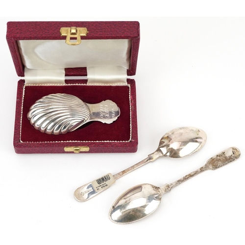 326 - Three silver spoons including a silver shell shaped caddy spoon by Francis Howard with fitted case, ... 