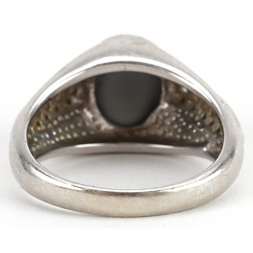 2039 - 9ct white gold cabochon ring with pierced shoulders, possibly hematite, size T, 9.2g