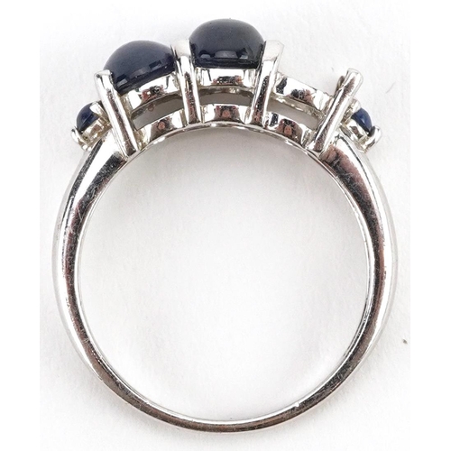 2519 - 9ct white gold cabochon sapphire ring, the largest sapphire approximately 7.10mm x 5.50mm, size N, 3... 