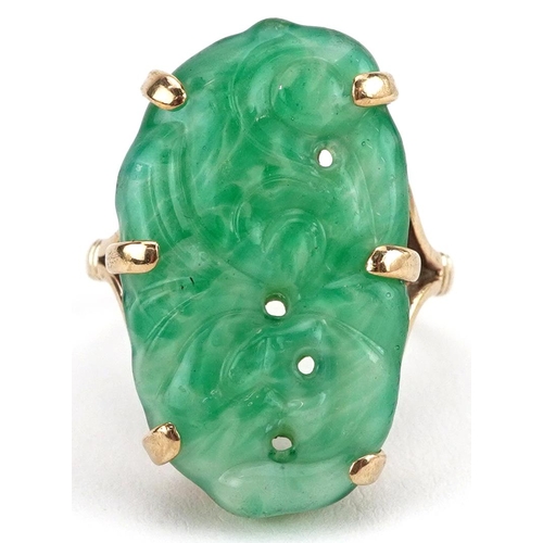 2142 - 9ct gold Chinese carved green jadeite ring, size O, 8.0g